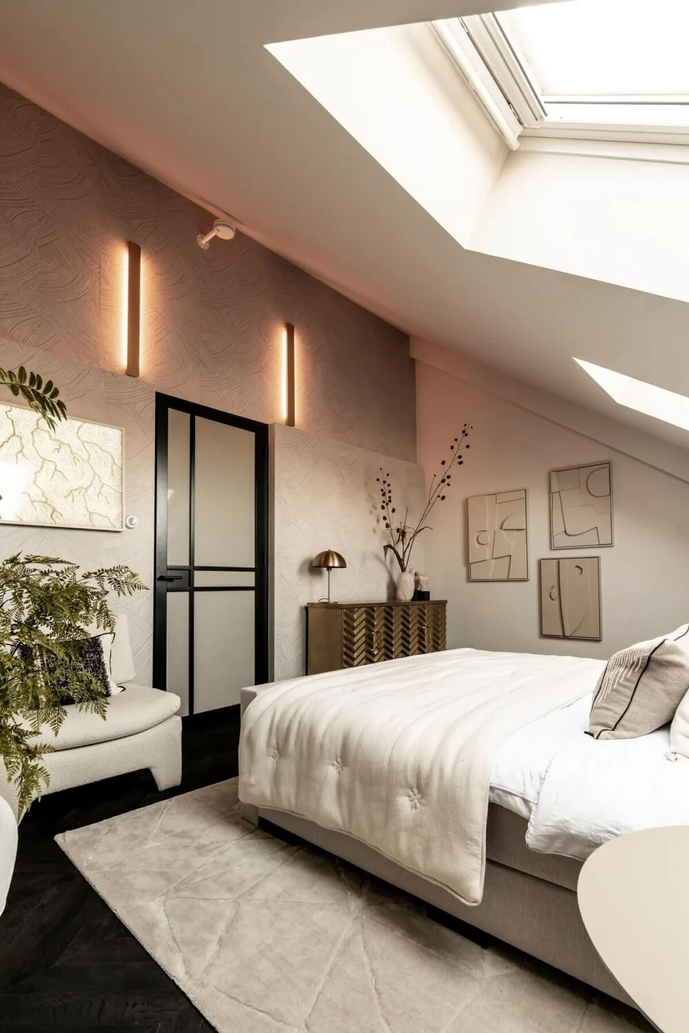 A Stylish Monochrome Penthouse in a Former Prison Building 20 attic-bedroom-slanted-ceiling-skylights-black-chevron-floor-nordroom