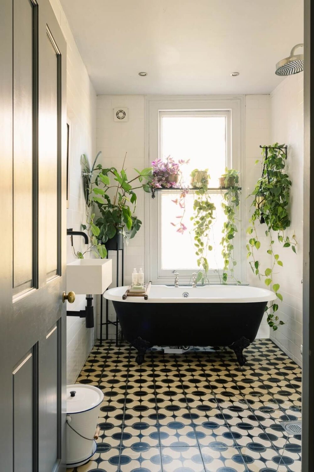 A Victorian House in London with Yellow Color Accents 16 bathroom-black-white-floor-tiles-plants-black-clawfoot-bath-nordroom