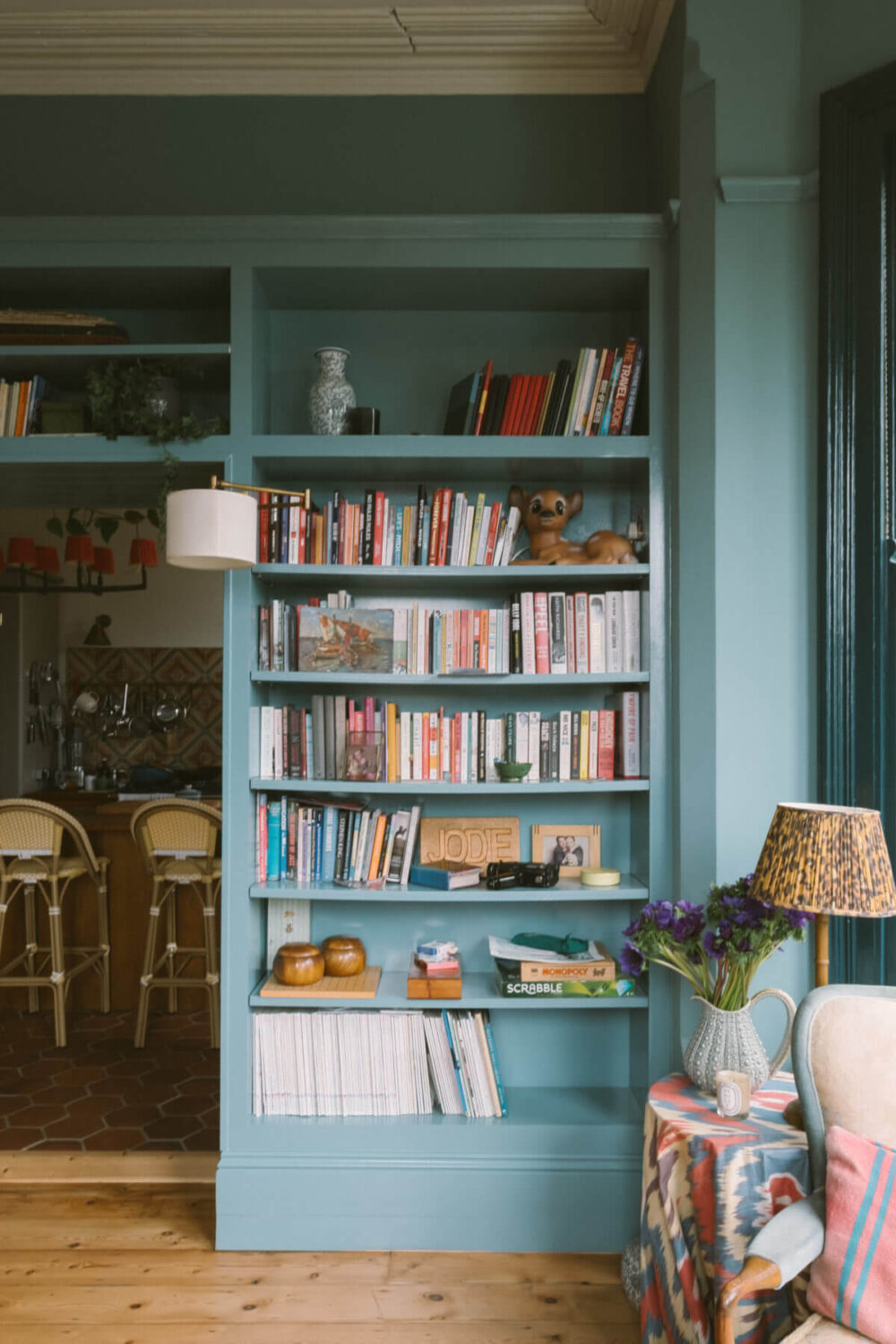 A Colorful Vintage Eclectic Home in England 2 blue-built-in-bookshelves-nordroom
