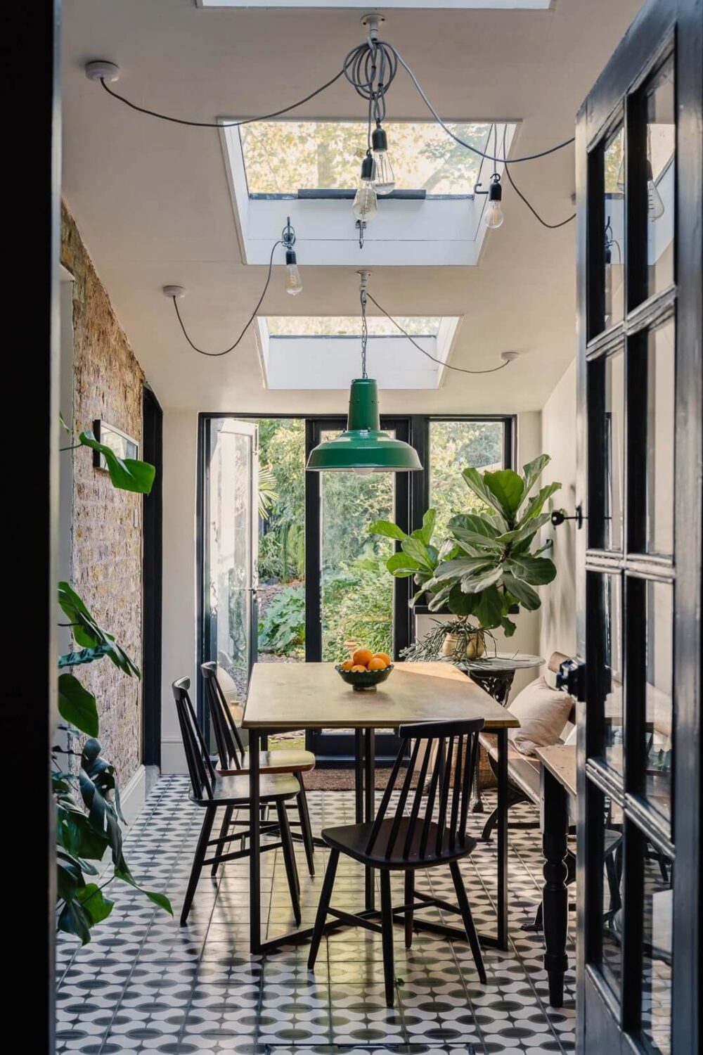 A Victorian House in London with Yellow Color Accents 1 dining-room-exterion-brick-wall-floor-tiles-skylight-nordroom