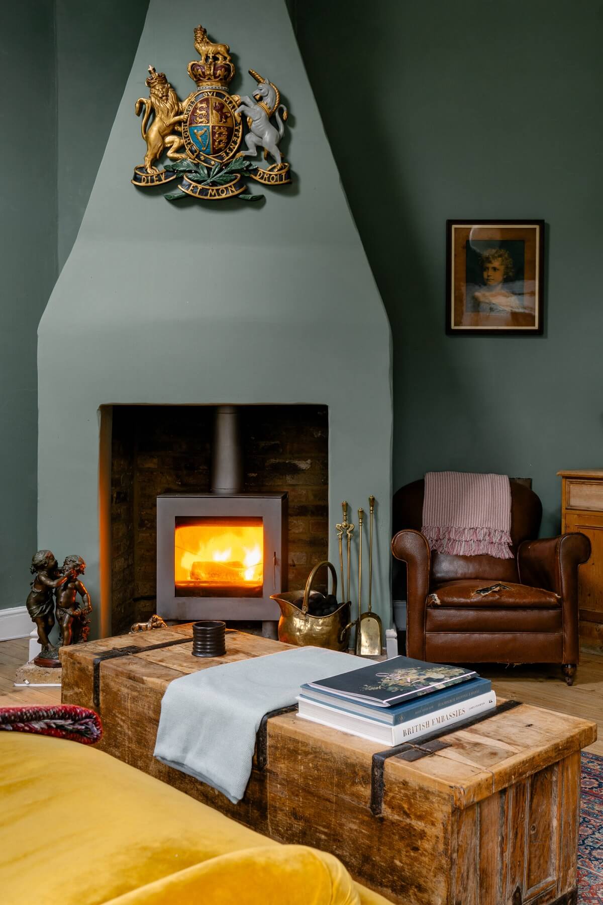 fireplace-sitting-room-green-walls-trunk-coffee-table-nordroom