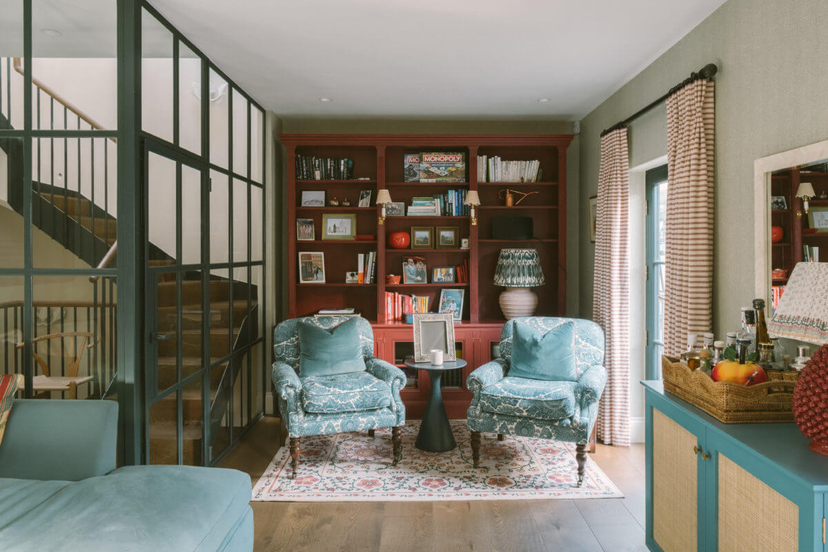 A London Mews House Made Famous in Love Actually 14 sitting-room-red-bookcase-steel-glass-door-wall-notting-hill-mews-house-nordroom
