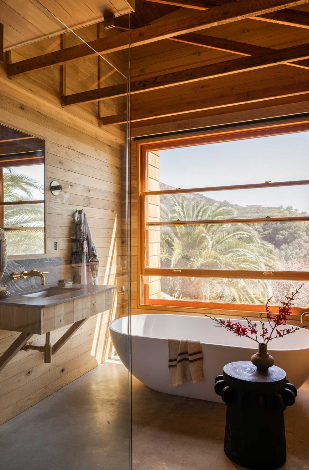 Best of 2022: Bathrooms 17 wooden-bathroom-pitched-roof-exposed-beams-freestanding-bath-nordroom