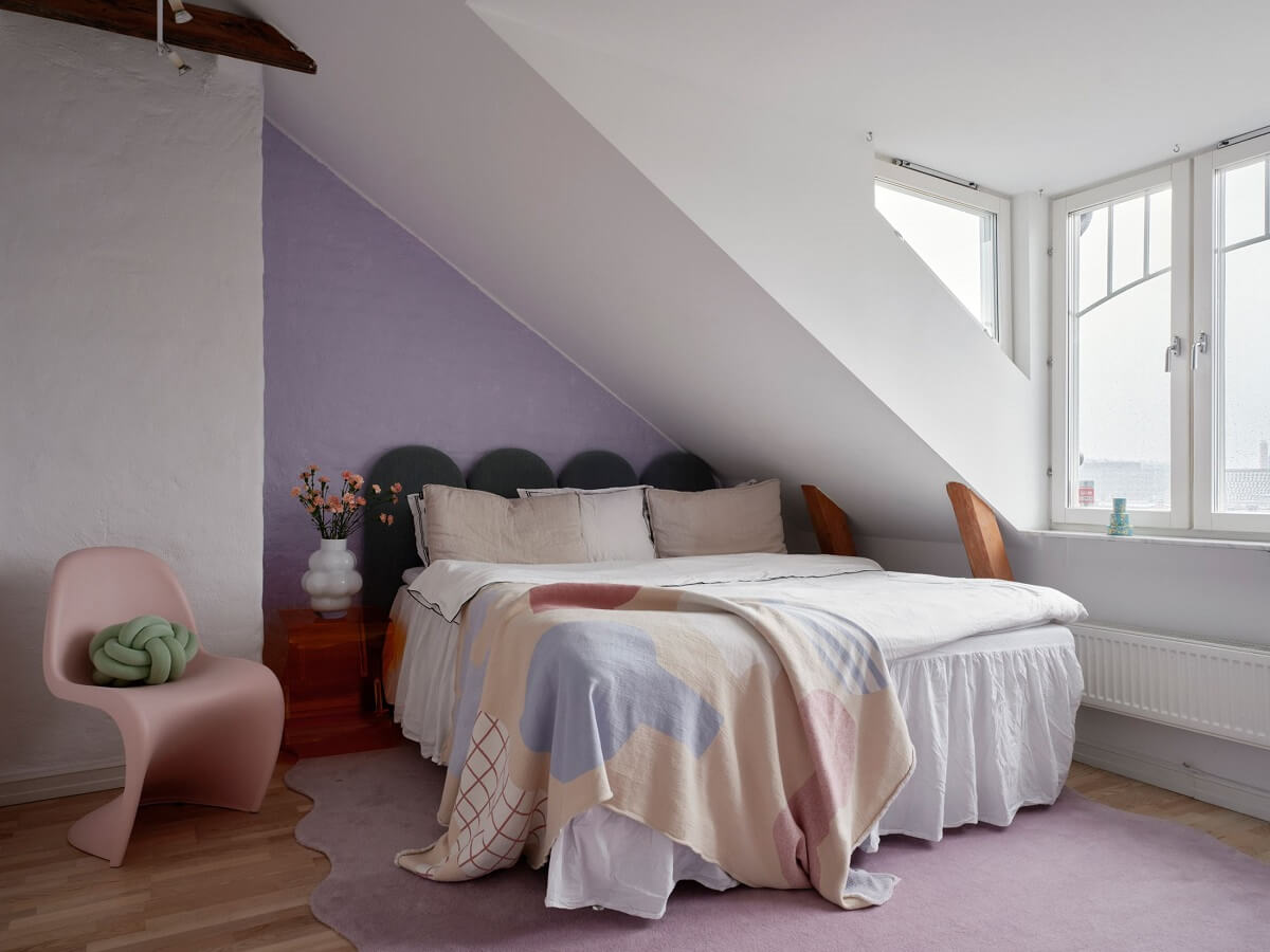 Pastel Color Accents in a Scandinavian Penthouse Apartment 15 attic-bedroom-lavender-pastel-accent-wall-nordroom