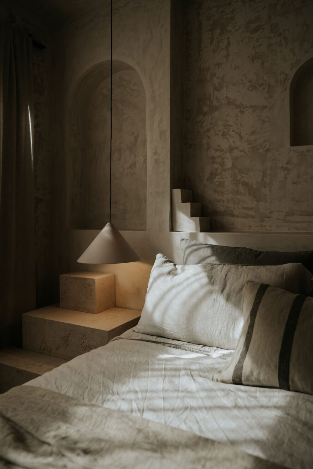 A Serene Design Apartment in Tulum 12 bedroom-detail-low-light-sculptural-arches-nordroom