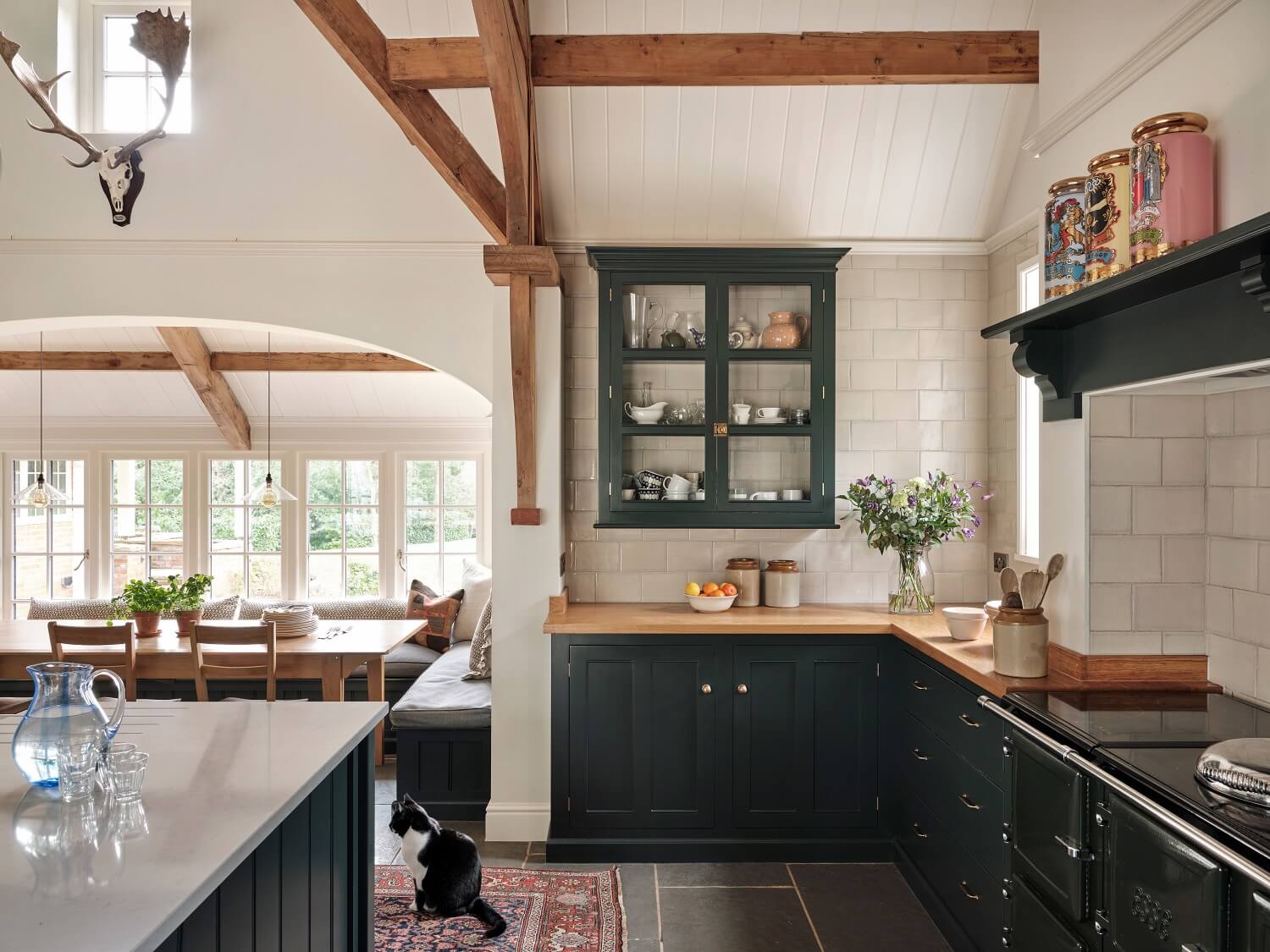 A Grand Family Kitchen in an English Country House 4 blue-kitchen-cabinets-devol-exposed-wooden-beams-wooden-worktop-nordroom