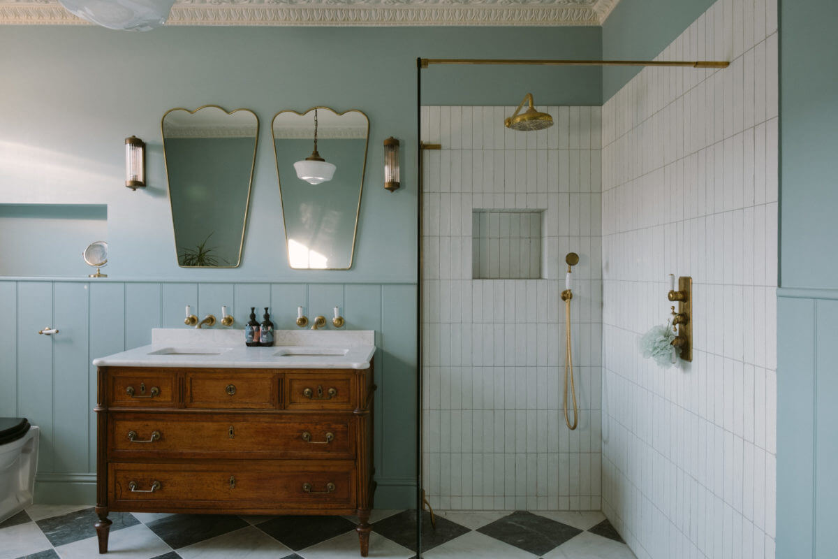 These Paint Colors Increase The Value of Your Home 1 light-blue-bathroom-antique-vanity-walk-in-shower-checkerboard-floor-nordroom