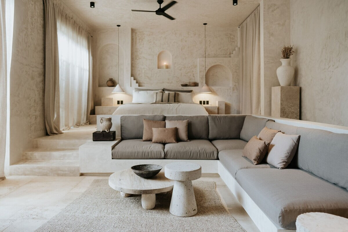 A Serene Design Apartment in Tulum 2 loft-style-living-room-sunken-sitting-room-built-in-sofa-nordroom