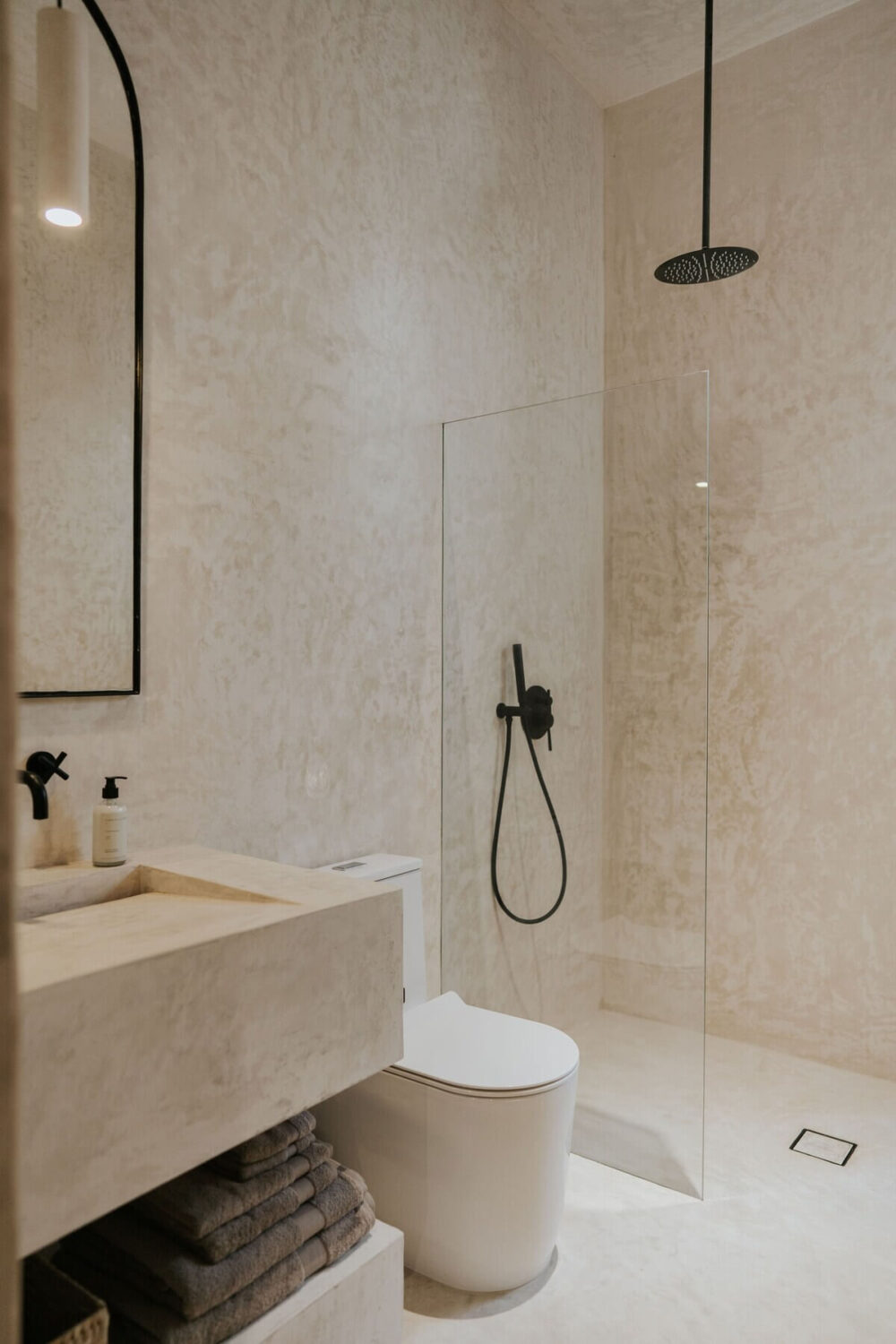 A Serene Design Apartment in Tulum 25 minimalistic-bathroom-walk-in-shower-black-fittings-nordroom