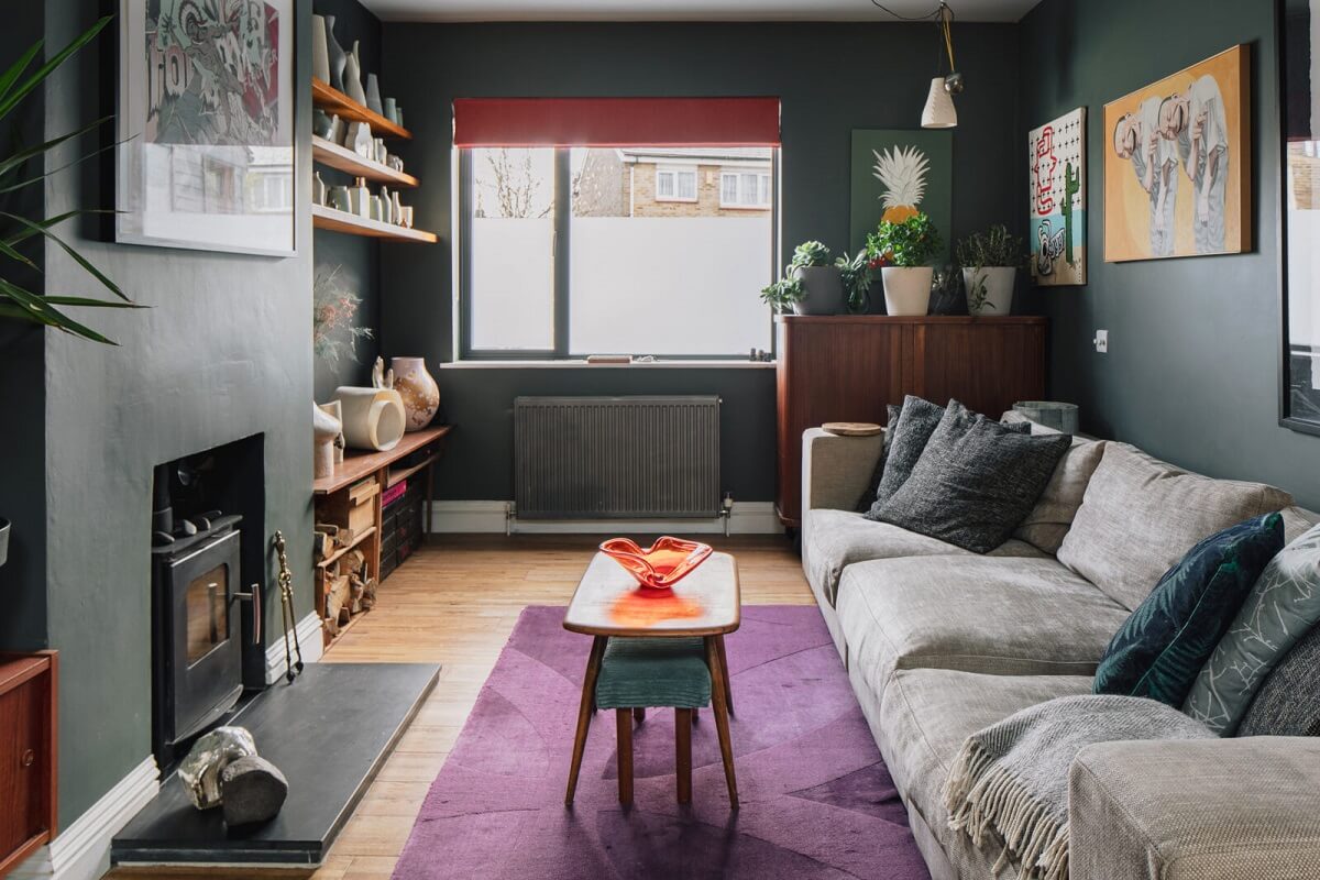 A London Home with Moody Rooms and a Pink Kitchen 2 moody-sitting-room-purple-rug-woodburner-nordroom
