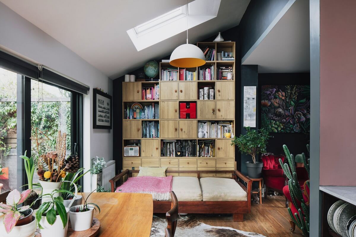A London Home with Moody Rooms and a Pink Kitchen 1 reading-nook-daybed-custom-bookcase-slanted-ceiling-skylight-nordroom