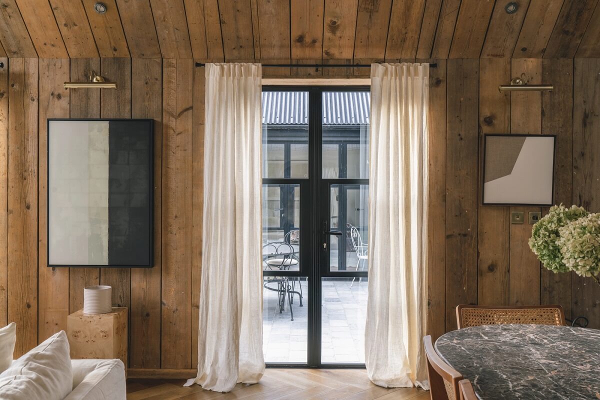 A Victorian Home with a Modern Black Extension 6 sitting-room-wood-plank-walls-ceiling-nordroom