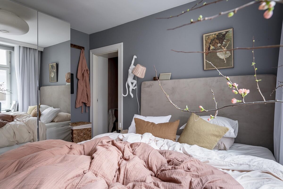 Layered Textiles and Dusty Colors in a Nordic Apartment 15 bedroom-mirror-wardrobe-gray-walls-nordroom