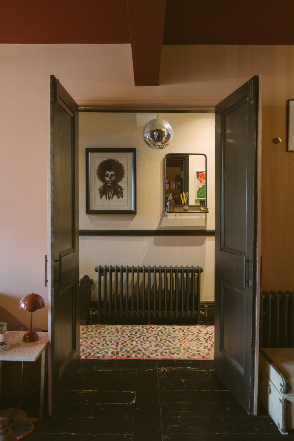 A Victorian House in London Decorated in Warm Color Tones 22 black-painted-double-doors-hallway-nordroom