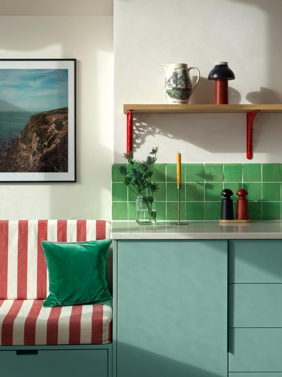 A Colorful House By The Sea Designed by Space A 3 kitchen-close-up-modern-blue-cabinets-green-backsplash-tiles-striped-red-bench-nordroom