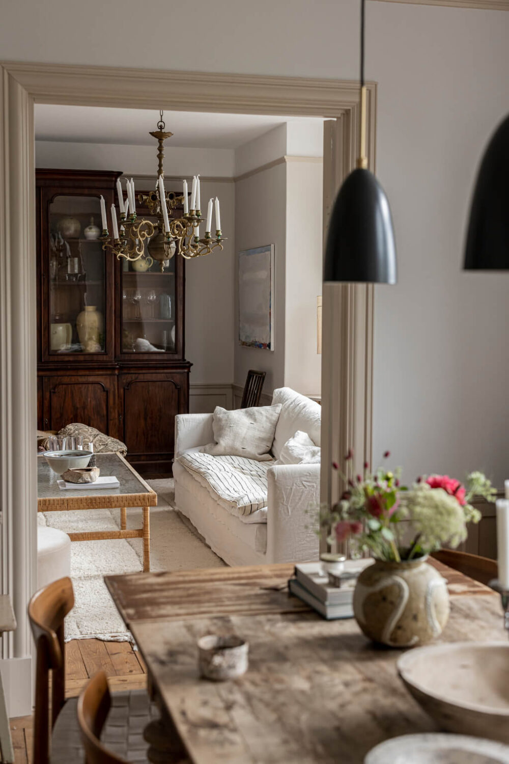A Scandinavian Apartment with Antique Furniture 1 kitchen-living-room-black-pendants-nordic-apartment-antique-furniture-nordroom