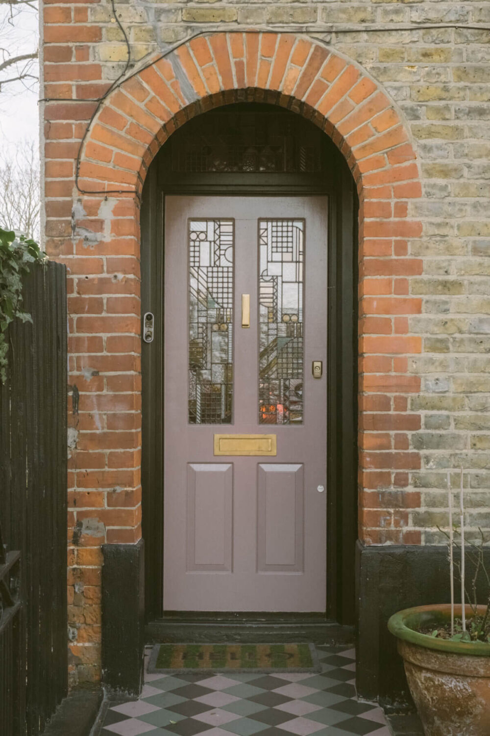 A Victorian House in London Decorated in Warm Color Tones 37 lavender-front-door-arched-doorway-exterior-victorian-house-london-nordroom