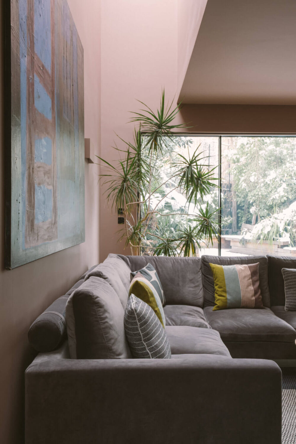 A Modern Split-Level Home with Colorful Rooms 10 living-room-skylight-pink-walls-nordroom