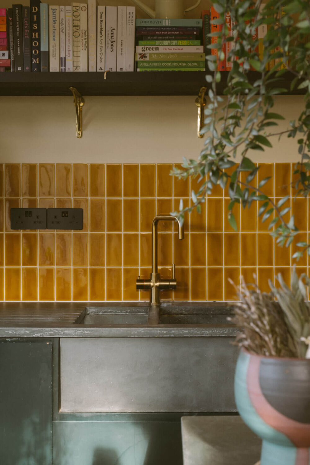 A Victorian House in London Decorated in Warm Color Tones 8 ochre-yellow-backsplash-tiles-kitchen-concrete-worktop-sink-nordroom