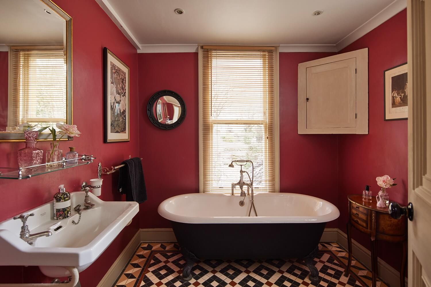 Inspiring Bathrooms With Geometric Tiles 12 bathroom-pink-red-walls-intricate-mosaic-tiled-floor-freestanding-bath-nordroom