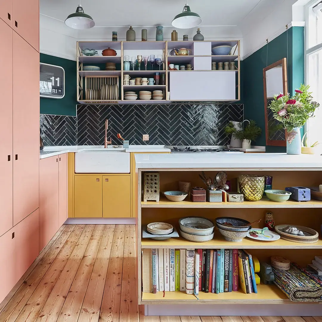 Best of 2023: Kitchens 31 pluck-kitchen-two-tone-cabinets-yellow-pink-wooden-floor-nordroom