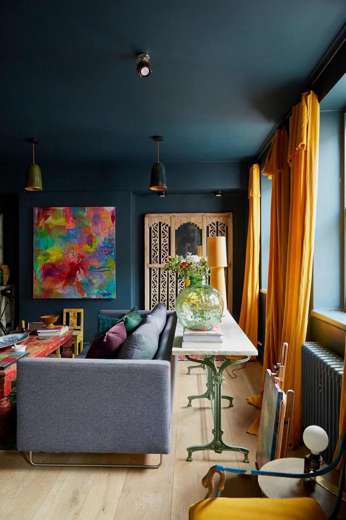 moody-blue-living-room-yellow-color-accents-nordroom