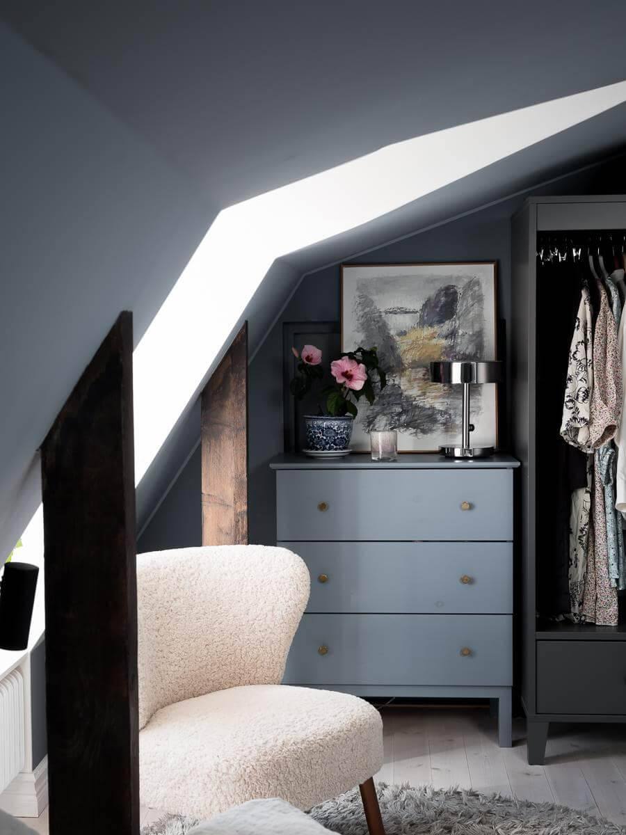 A Scandinavian Duplex That Blends Old and New 16 reading-nook-wardrobes-blue-attic-bedroom-nordroom