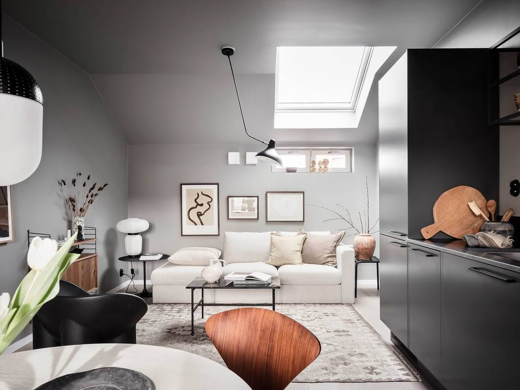 A Small Gray Attic Apartment in Sweden 1 scandinavian-attic-apartment-gray-walls-black-kitchen-skylight-nordroom