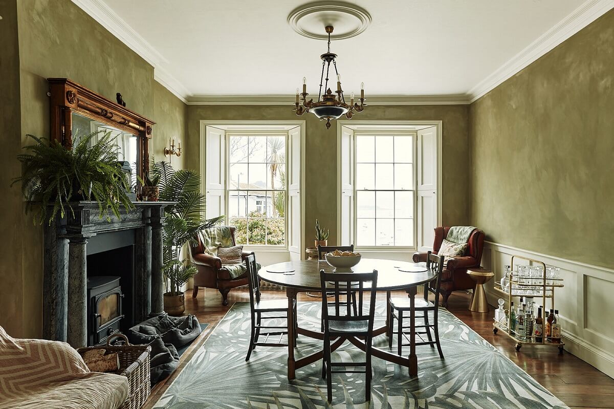 Best of 2023: Dining Rooms 16 dining-room-green-walls-round-table-large-rug-fireplace-nordroom