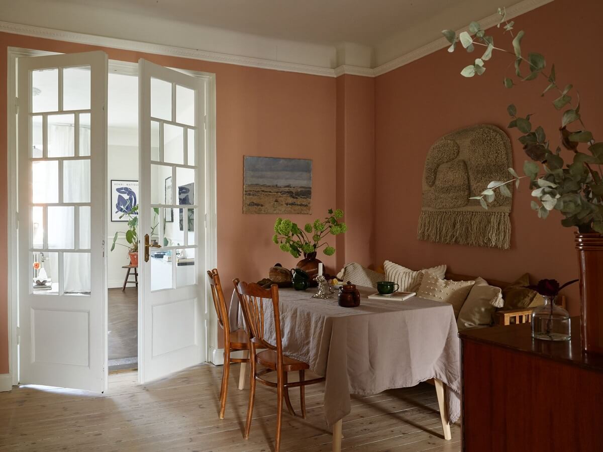 A Scandinavian Apartment with a Light Green Bedroom 7 dining-room-pink-walls-wooden-floor-nordroom