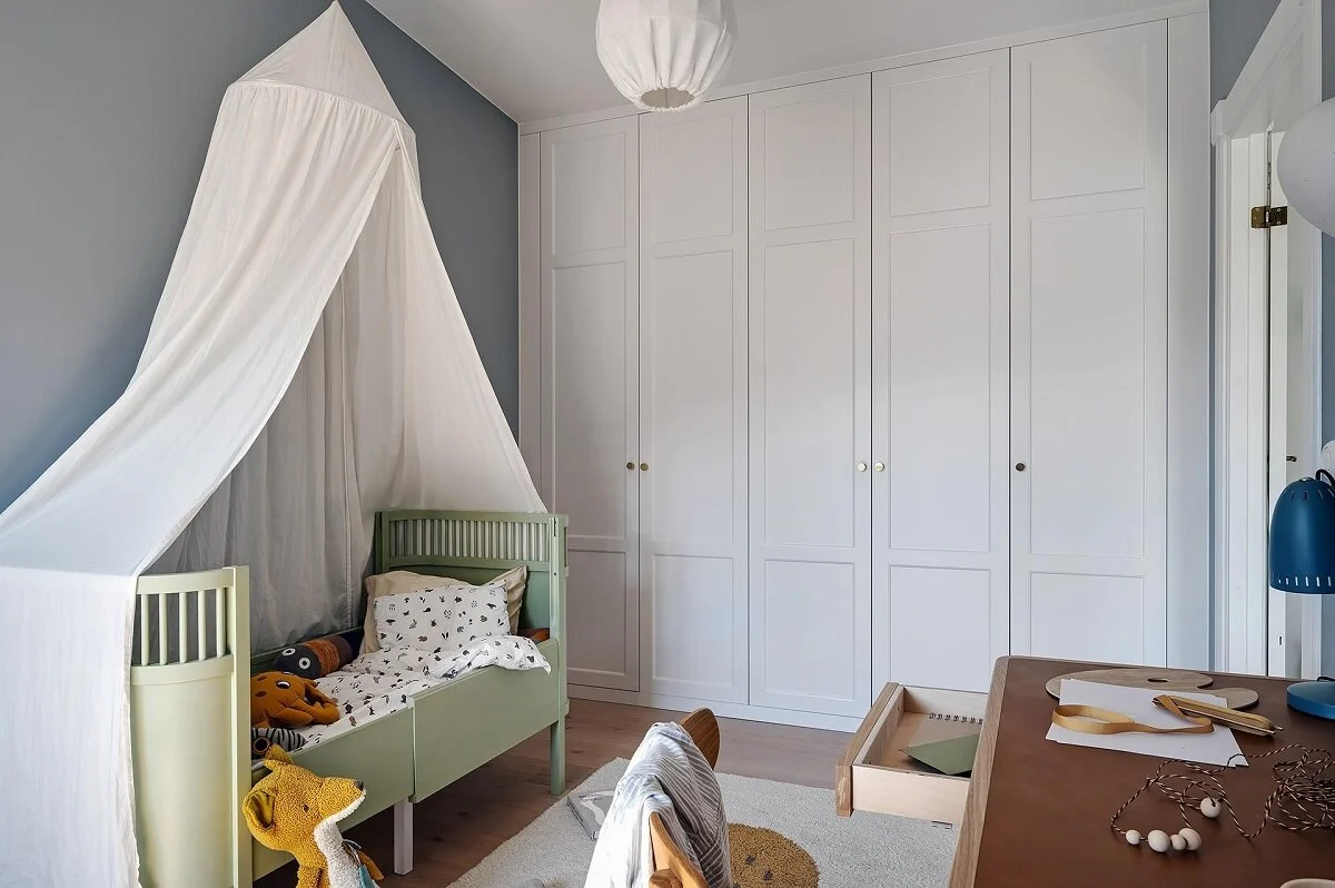 A Modern Scandinavian Attic Apartment 24 kids-bedroom-light-green-bed-built-in-wardrobes-nordroom