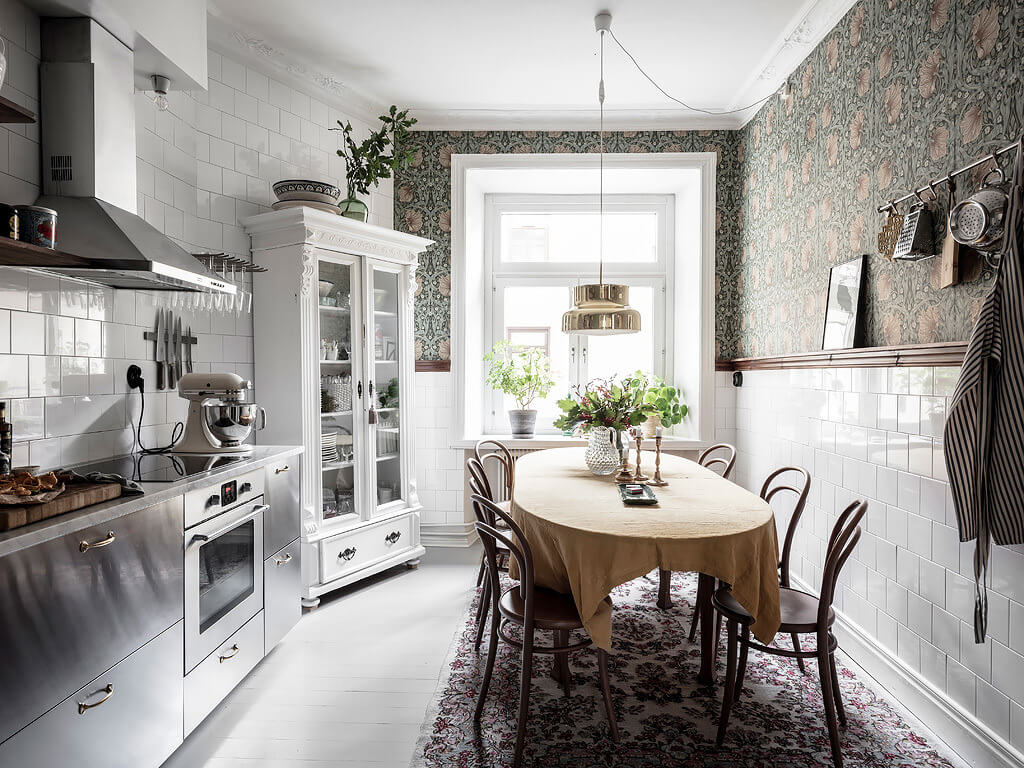 kitchen large dining table green william morris wallpaper nordroom A Scandi Home with Stainless Steel Kitchen and Wallpaper