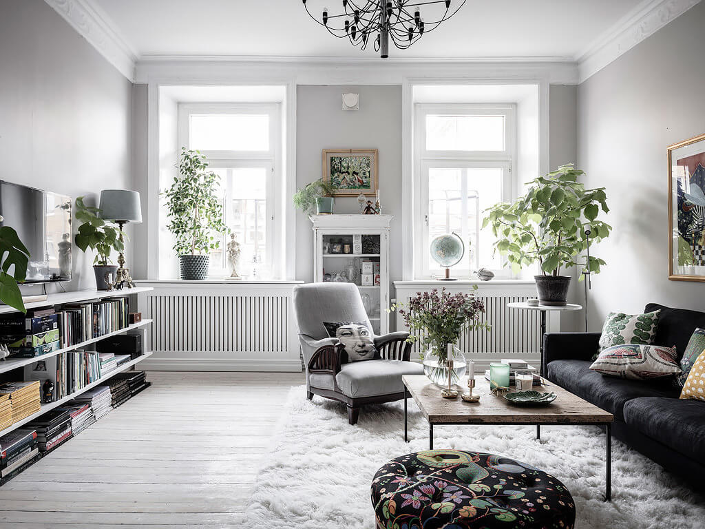 living room gray walls bookshelves nordroom A Scandi Home with Stainless Steel Kitchen and Wallpaper