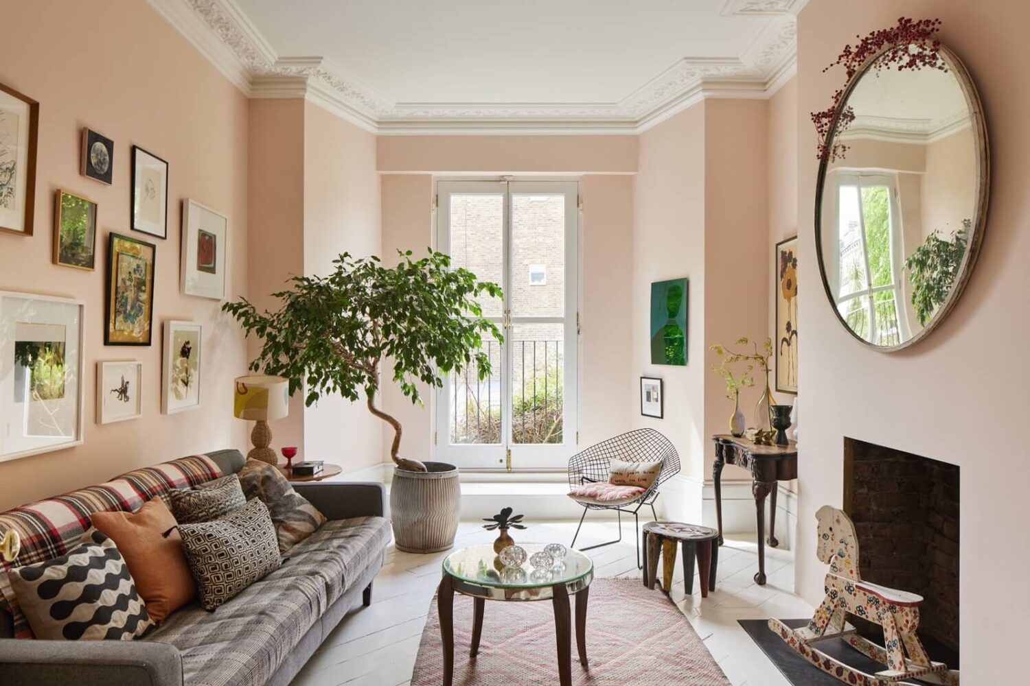 A Light Victorian Townhouse with Teal Reading Room 1 living-room-light-pink-walls-round-mirror-gallery-wall-nordroom