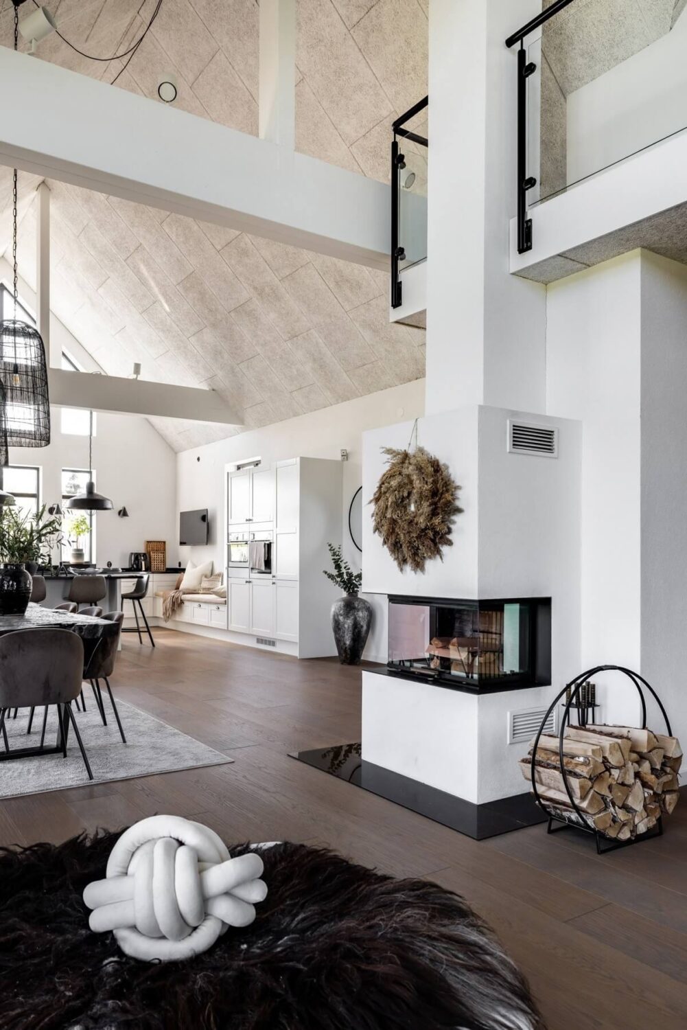 A Monochrome Swedish Villa with High Ceilings 7 monochrome-scandinavian-villa-fireplace-vaulted-ceiling-nordroom