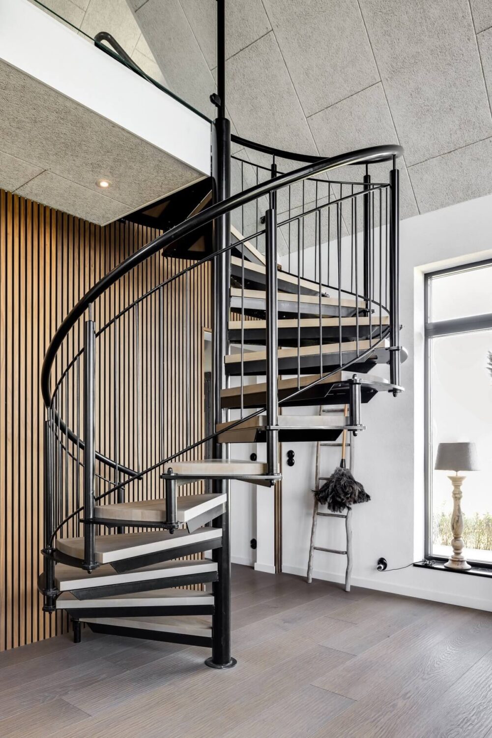 A Monochrome Swedish Villa with High Ceilings 18 spiral-staircase-wooden-accent-wall-nordroom