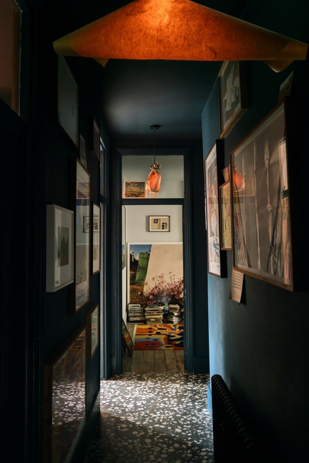 Trend Alert: 36x Color-Drenched Rooms 31 moody-deep-blue-hallway-terrazzo-floor-nordroom