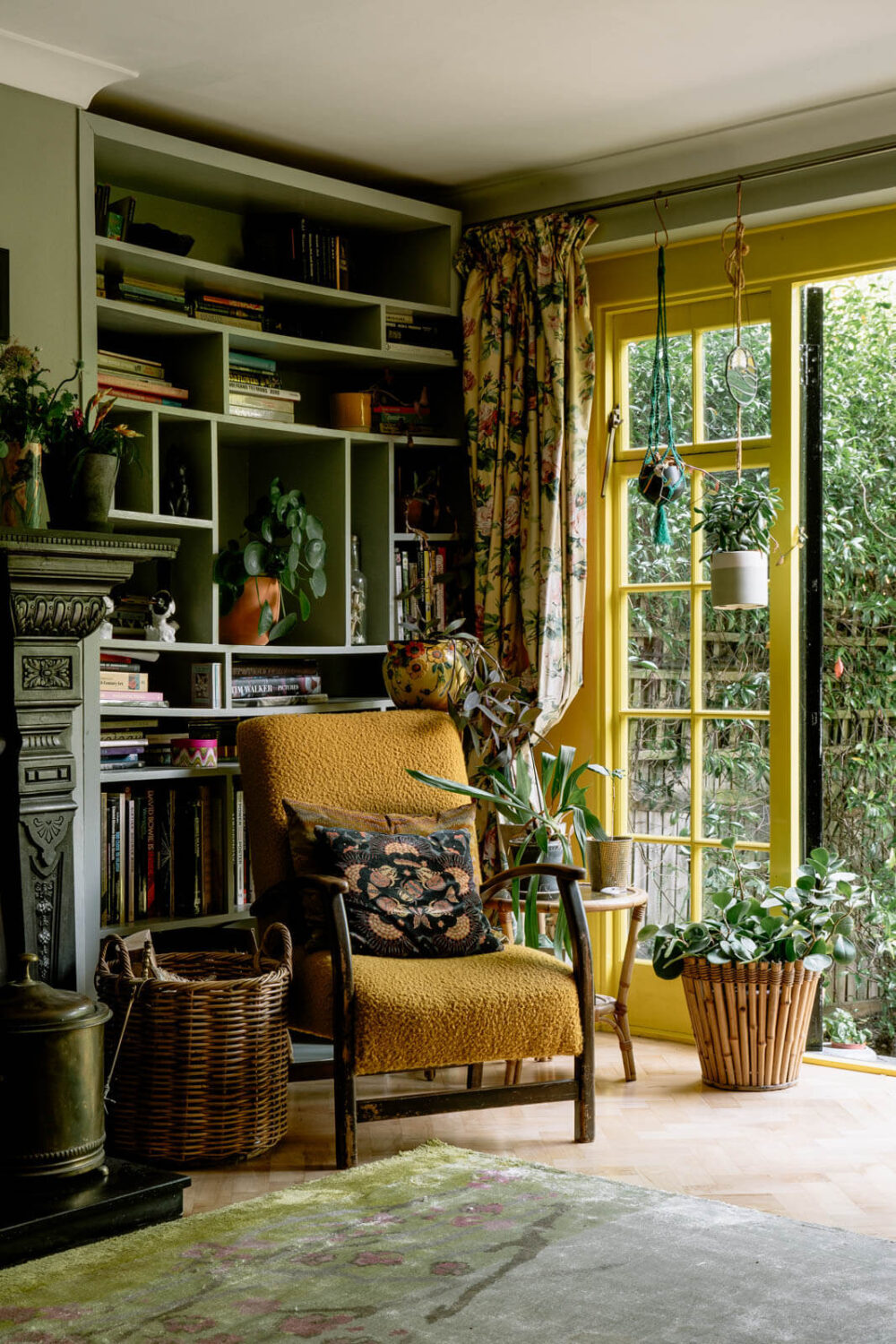 The Top Home Design Trends for 2026: Bold Color, Cozy Corners & Climate-Ready Living 8 reading-nook-bookcase-yellow-doorframes-nordroom