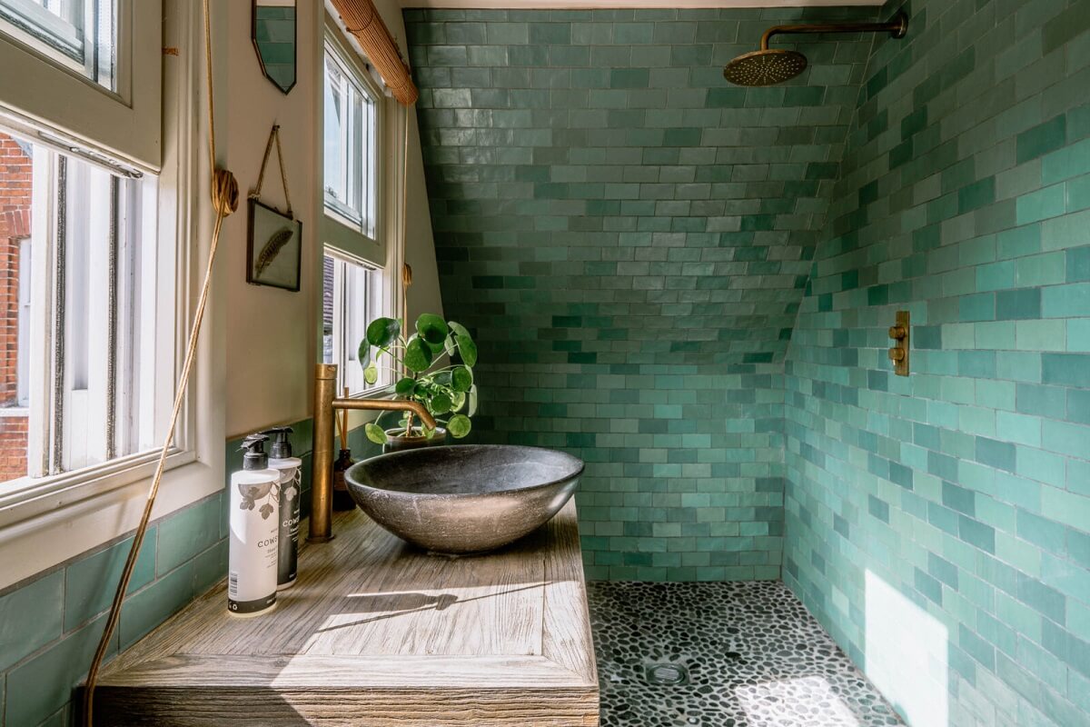 A Warm Living Room in a Historic English Home 23 bathroom-shower-blue-tiles-slanted-ceiling-nordroom