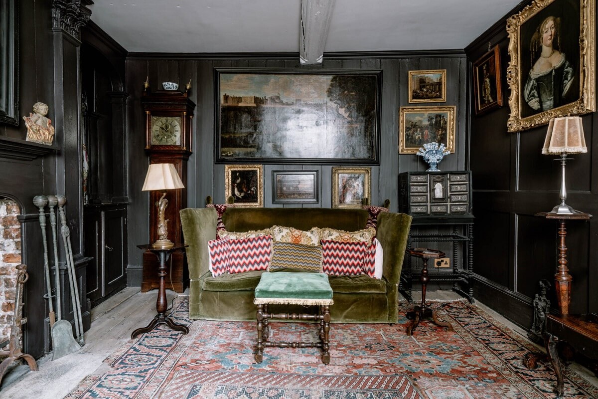 A Unique Historic House Near the English Coast 7 dark-gray-sitting-room-green-couch-antique-furniture-art-nordroom