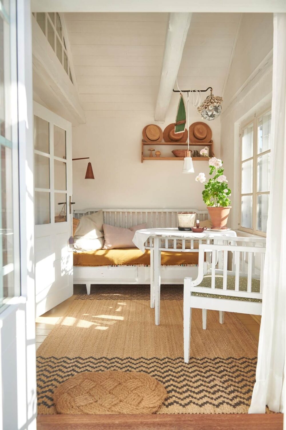 Natural Light in a Charming Swedish Country House 1 garden-room-bench-yellow-cushion-nordroom