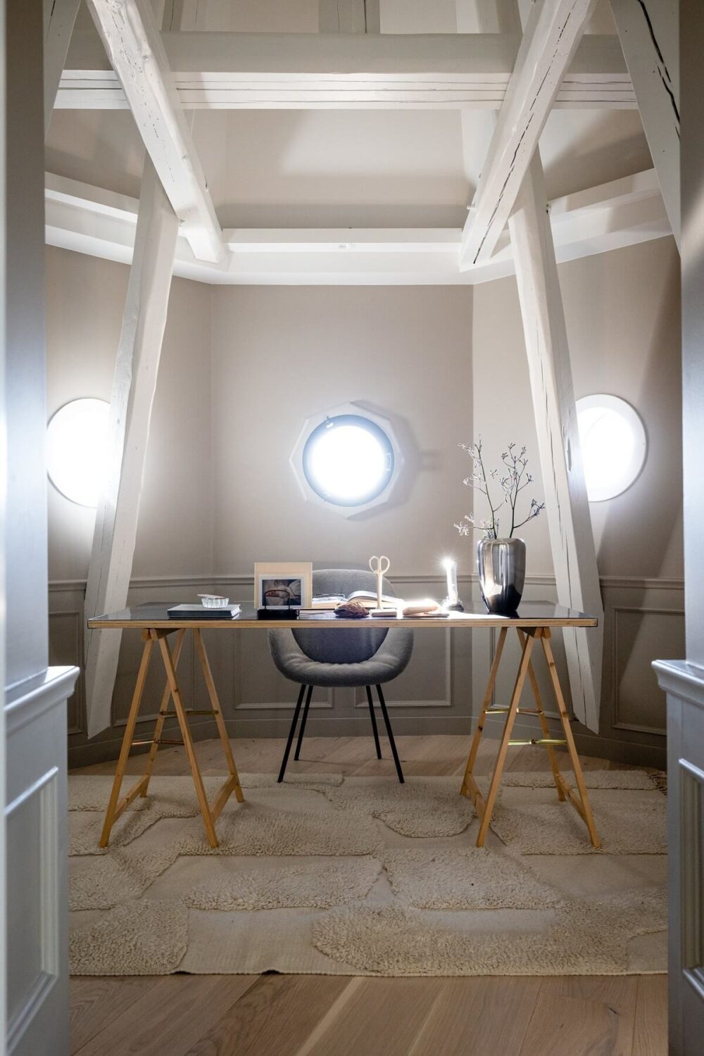 A Bright Penthouse Apartment in Oslo 10 home-office-round-windows-exposed-beams-nordroom