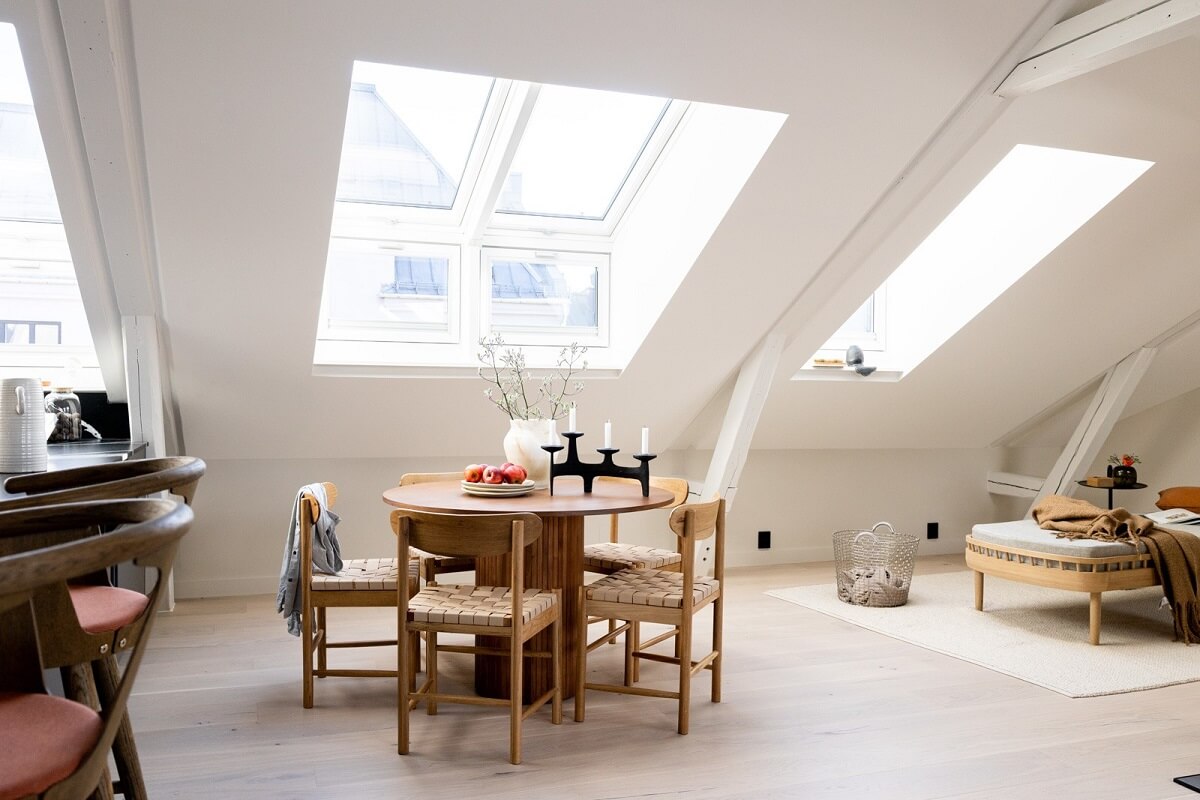 A Bright Penthouse Apartment in Oslo 5 round-wooden-dining-table-attic-apartment-nordroom