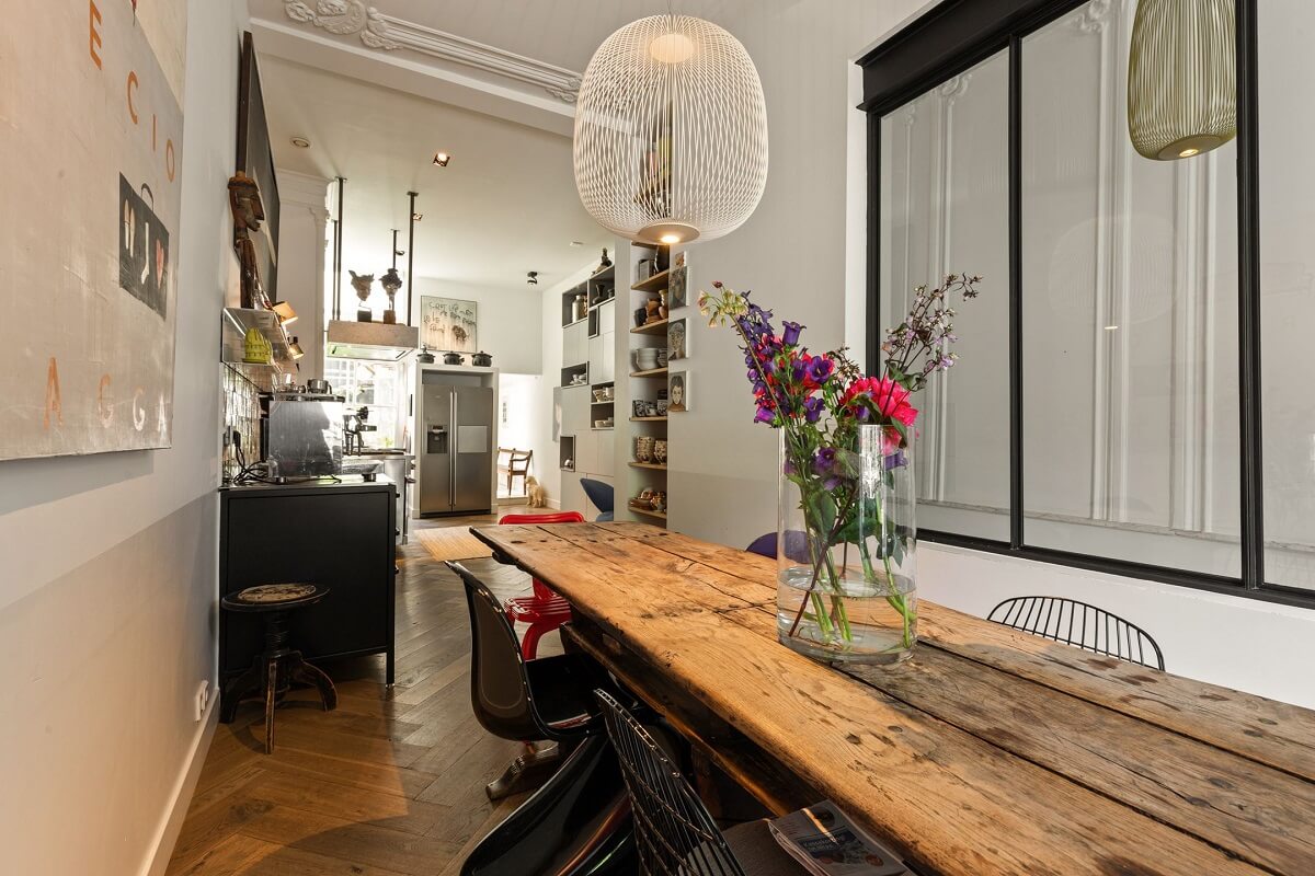 A Family Home in a Historic Canal House 1 rustic-dining-table-glass-wall-nordroom