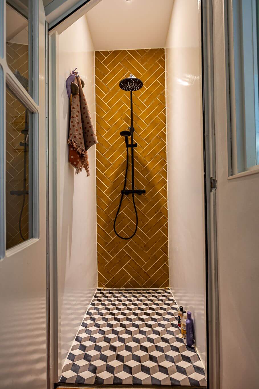A Colorful Church Conversion in The Netherlands 19 shower-room-mustard-yellow-walls-tiles-geometric-floor-tiles-nordorom