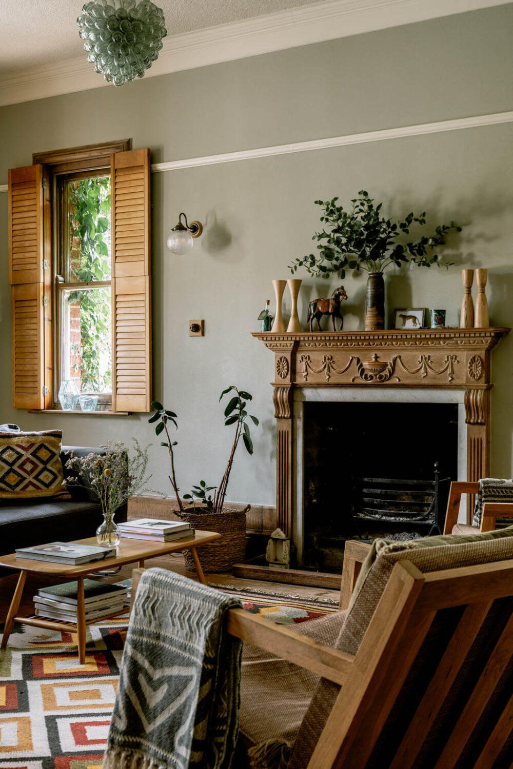A Warm Living Room in a Historic English Home 2 warm-living-room-bohemian-textures-carved-wooden-fireplace-nordroom