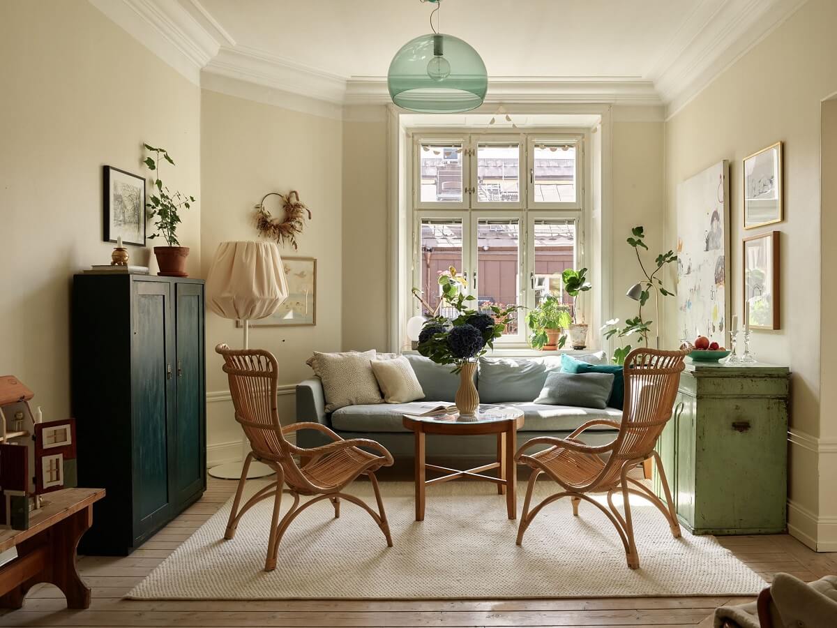 Beige Walls in a Serene Family Apartment in Sweden 1 cozy-living-room-rattan-chairs-nordroom