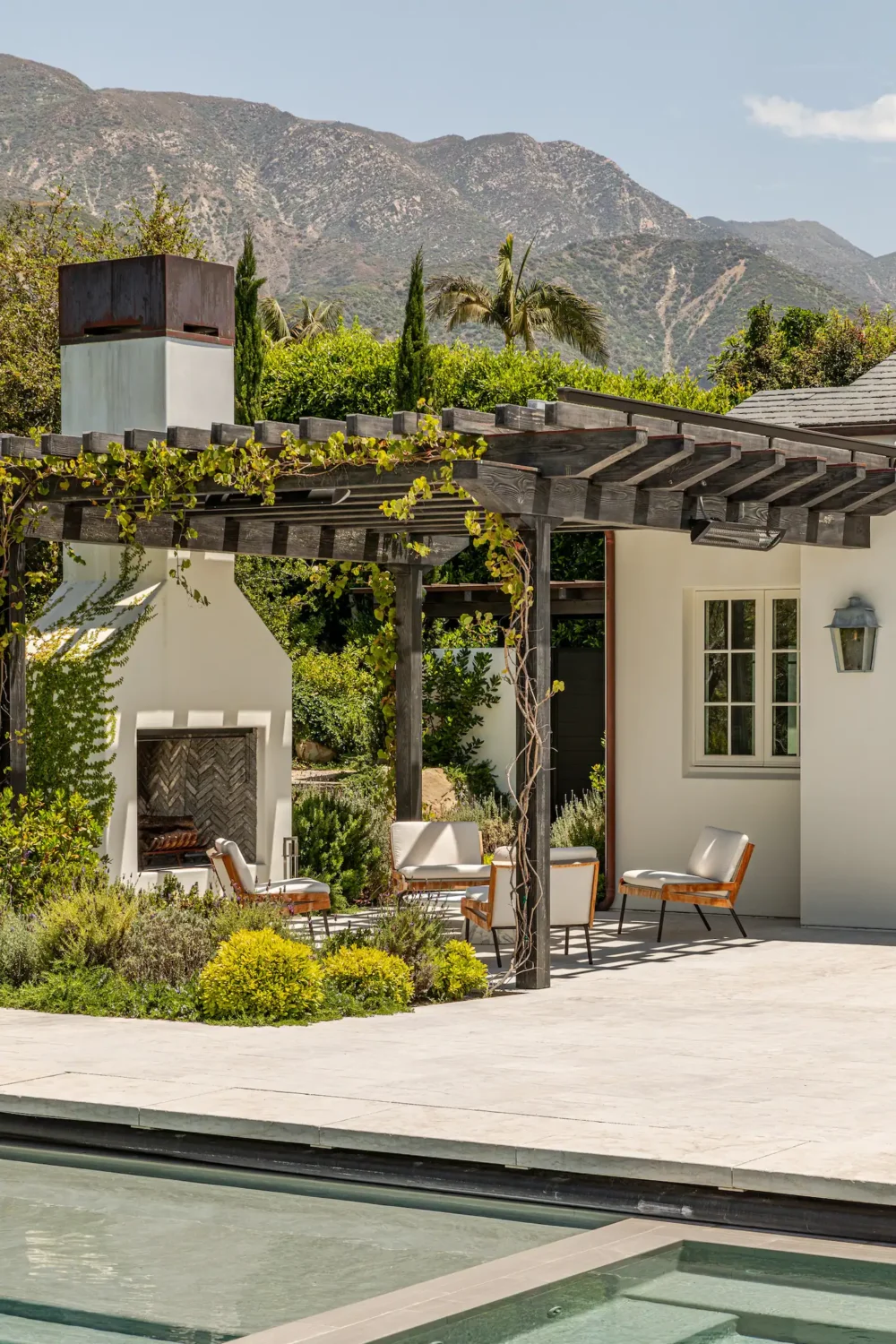 Gwyneth Paltrow's Serene Guesthouse in Montecito 12 garden-terrace-outdoor-fireplace-nordroom