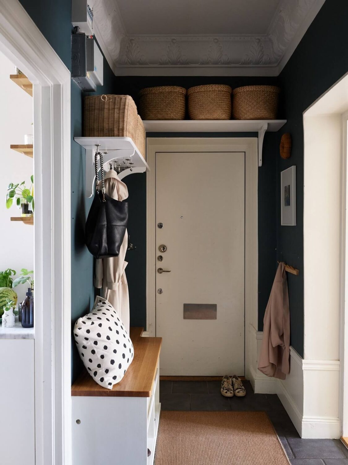 Beige Walls in a Serene Family Apartment in Sweden 29 hallway-entry-shelves-blue-walls-nordroom