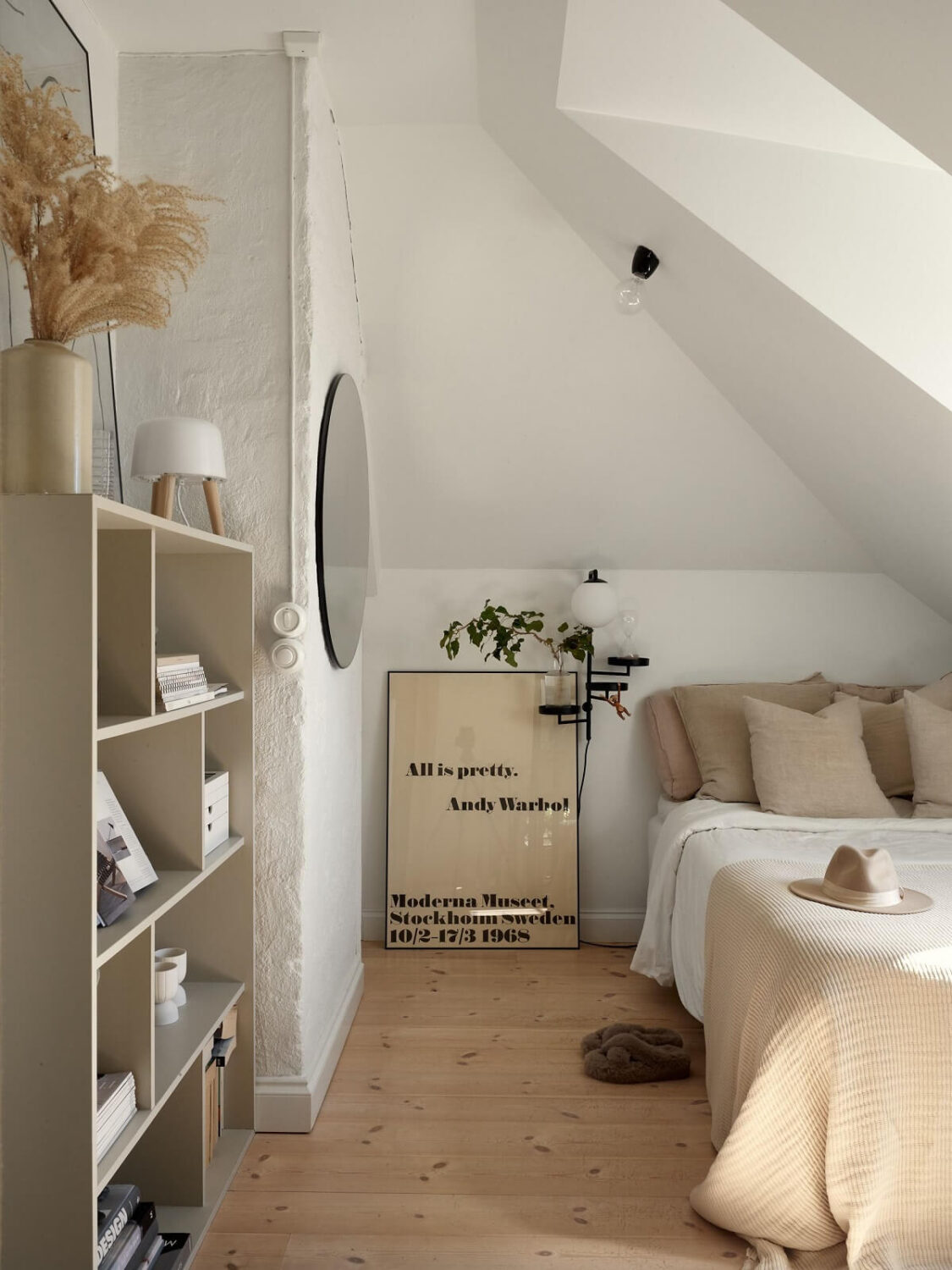 A Small Attic Apartment with Industrial Glass walls 13 small-attic-bedroom-slanted-ceiling-nordroom